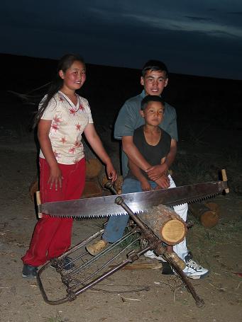 Kids making fire wood in the night